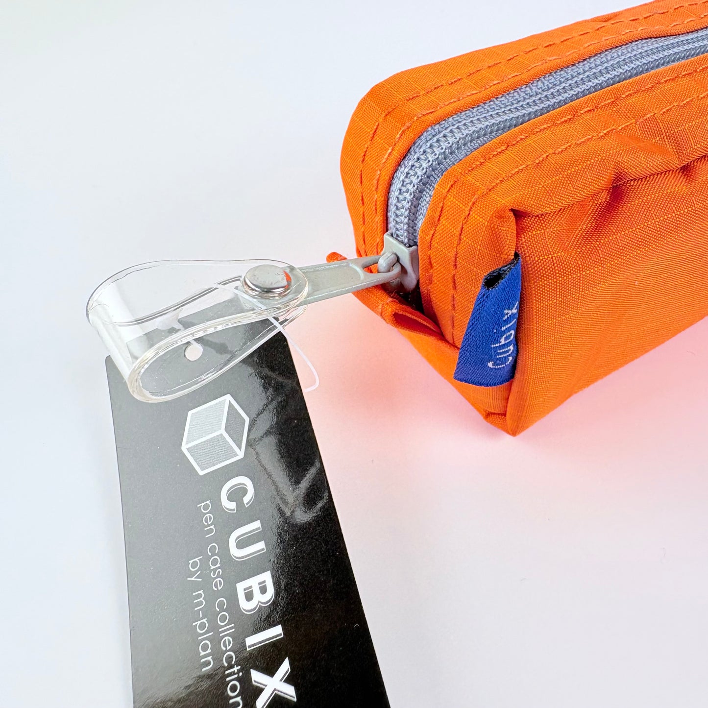 Penál CUBIX / M-PLAN – oranžové pouzdro na psací potřeby, japonský design