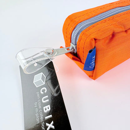 Penál CUBIX / M-PLAN – oranžové pouzdro na psací potřeby, japonský design
